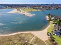 CUSTOM HOME IN PRIVATE WATERFRONT SETTING