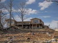 BEAUTIFUL FOUR BEDROOM HOME OVERLOOKING LAKE OF THE OZARKS