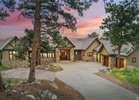 EXPANSIVE CUSTOM STUCCO AND STONE HOME IN GENESEE PARK
