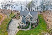 STATELY WATERFRONT HOME IN PRESTIGIOUS PEBBLE BAY