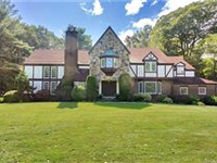ELEGANT TUDOR COLONIAL HOME IN PRIVATE NATURAL SETTING