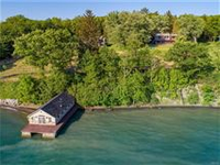 EXPERIENCE THIS LOVINGLY RESTORED LAKEFRONT HOME TO APPRECIATE ITS MAGIC