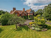 ELEGANT EARLY TUDOR REVIVAL WITH LUSH GARDENS