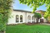 SPANISH-STYLE HOME WITH DEVELOPMENT POTENTIAL