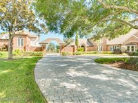 BEAUTIFUL TWO-STORY BRICK ESTATE HOME WITH GUEST HOME ON .7 ACRE