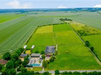 SPACIOUS FARMHOUSE ON EIGHTEEN EXCEPTIONAL EQUESTRIAN ACRES