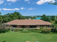 ELEGANT ONE-OF-A-KIND ESTATE WITH SWEEPING VIEWS OF WHITE ROCK LAKE