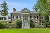 MAGNIFICENT GATED STONE COLONIAL ON FOUR ACRES
