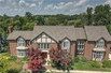 THIS MAJESTIC TUDOR SITS ON A LUSH PRIVATE LOT WITH PRIVACY AND NATURE