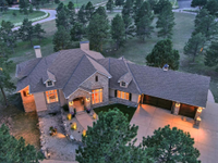 TUCKED AMONG THE TREES ON OVER FIVE ACRES