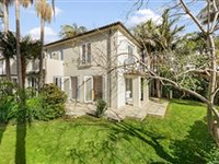 DUAL-LEVEL ITALIAN VILLA STYLE HOME