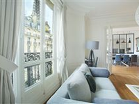 ELEGANT LIGHT-FILLED APARTMENT ENJOYS A VIEW OF THE EIFFEL TOWER