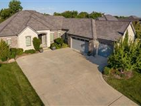 AN INVITING OPEN FLOOR PLAN HOME IN A BEAUTIFUL GATED COMMUNITY