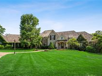 TIMELESS ELEGANCE ABOUND IN THIS CUSTOM, ESTATE-LIKE HOME