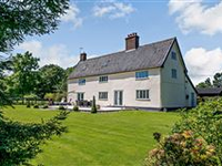 BEAUTIFUL AND SPACIOUS FARMHOUSE WITH BARNS SET ON PICTURESQUE 15 ACRES