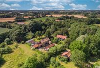 AIRY AND LIGHT WALNUT FARM PROPERTY SET ON 15 ACRES