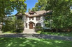 LOVELY STUCCO HOME WITH CLASSIC ARCHITECTURAL DETAILS