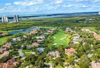 CUSTOM HOME OVERLOOKING GOLF COURSE IN PREMIER BONITA BAY