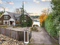 DOUBLE GATED GRAVELLY LAKE WATERFRONT CUSTOM BUILT HOME WITH VIEWS OF MT. RAINIER