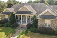 CUSTOM BUILT HOME OFFERING PANORAMIC VIEWS AND AN EQUESTRIAN FACILITY