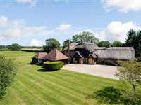 A STRIKING HOME WITH WONDERFUL FAR REACHING VIEWS IN GARDENS AND GROUNDS