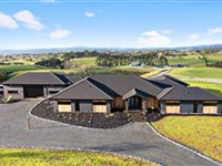 PICTURESQUE BRICK AND REDWOOD RESIDENCE IN PUKEKOHE