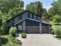 A TIMELESS MODERN HOME NESTLED ON AN ACRE OF PRIVACY