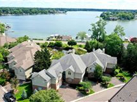 ENJOY LAKEFRONT CONDO LIVING ON EXVLUSIVE PINE LAKE