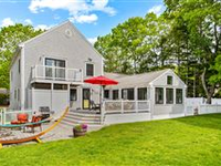 A STUNNING CUSTOM COLONIAL LOCATED STEPS FROM A PRIVATE BEACH