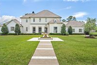 REMARKABLE HOME SITUATED ON AN EXPANSIVE GOLF COURSE LOT