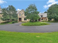 BREATHTAKING HOME ON FIVE-PLUS SECLUDED ACRES