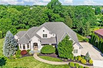 HOME NESTLED ON PRIVATE WOODED LOT