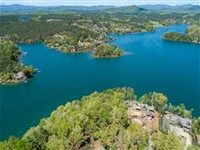 WATERFRONT PROPERTY WITH CRYSTAL BLUE WATERS AND MOUNTAIN VIEWS
