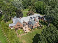 GRIMSWORTHY MANOR IS A MAGNIFICENT GATED ESTATE ON SECLUDED TWO PLUS ACRES