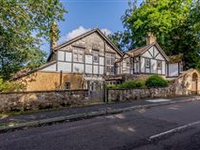 IMPRESSIVE TUDOR REVIVAL FAMILY HOME WITH STUNNING ELEVATED VIEWS