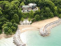 SPECTACULAR ESTATE WITH MESMERIZING LAKE VIEWS AND BEACH LIKE NO OTHER!