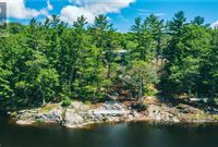 AN OASIS OF PRIVACY AND QUIETUDE ON A PRISTINE SMALL LAKE