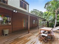 STATELY NATURAL WOOD HOME IN A PRIME COASTAL SETTING