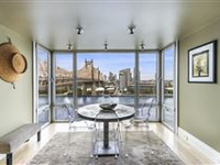 DESIGNER CONDO WITH BREATHTAKING VIEWS OF CITY AND EAST RIVER
