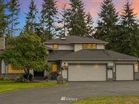 BEAUTIFULLY APPOINTED HOME IN THE DESIRABLE WOODSTONE NEIGHBORHOOD