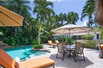 CHIC AND CHARMING HOME ON A PRIVATE AND TROPICALLY LANDSCAPED CORNER LOT