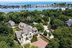 GORGEOUS STUCCO MASTERPIECE NESTLED ON COHASSET LEDGE
